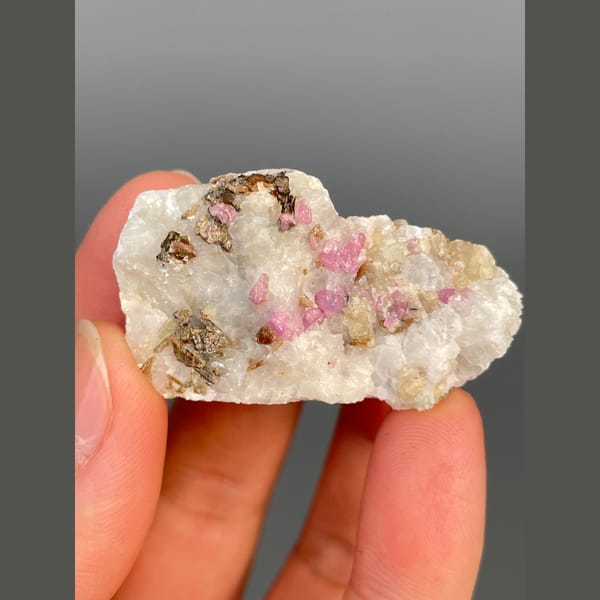 Pink-red corundum in white marble from Yunnan — alternate view