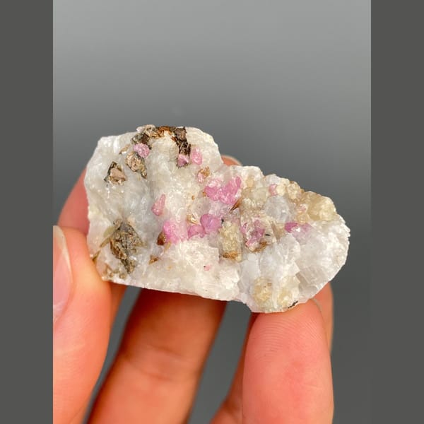 Pink-red corundum in white marble from Yunnan — alternate view