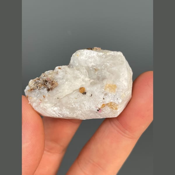Pink-red corundum in white marble from Yunnan — detail view