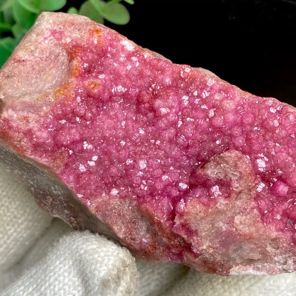 Hot pink cobaltoan calcite druzy on matrix — detail view