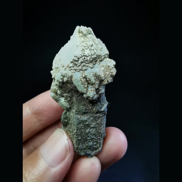 Quartz crystal capped with a thick calcite coating — alternate view