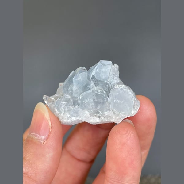Pale blue celestite cluster from Madagascar — complete view