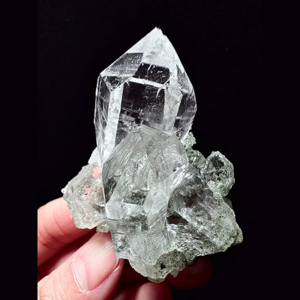 Clear Himalayan quartz cluster with green phantom base from India — alternate view