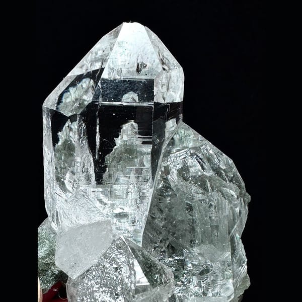 Clear Himalayan quartz cluster with green phantom base from India — detail view