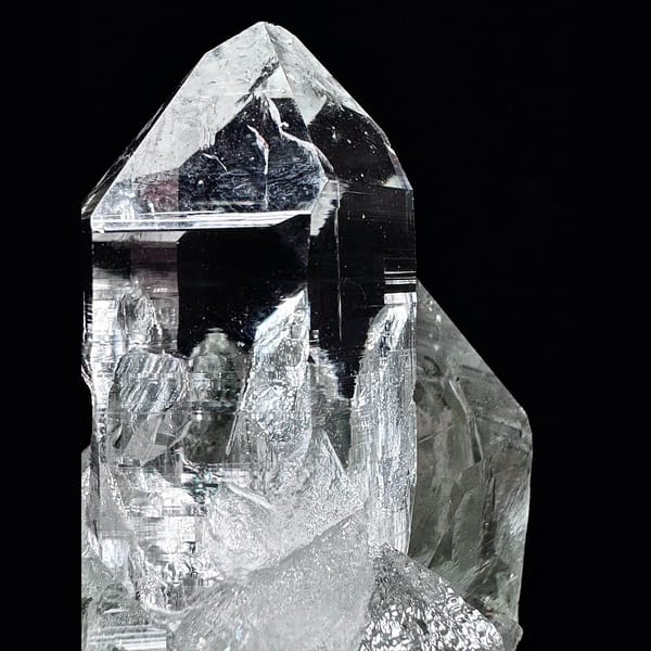 Clear Himalayan quartz cluster with green phantom base from India — detail view