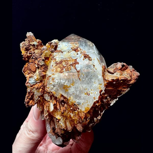 Double-terminated quartz floater with golden crust from Hashupi, Pakistan — alternate view