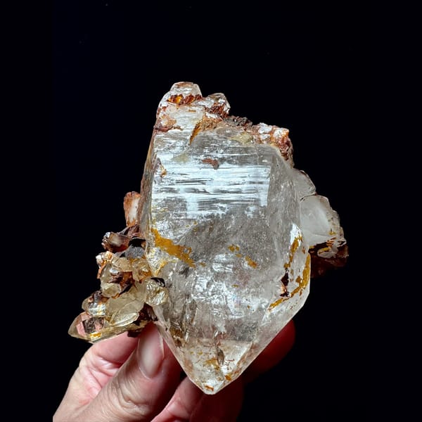 Double-terminated quartz floater with golden crust from Hashupi, Pakistan — alternate view