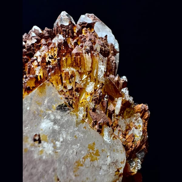 Double-terminated quartz floater with golden crust from Hashupi, Pakistan — detail view