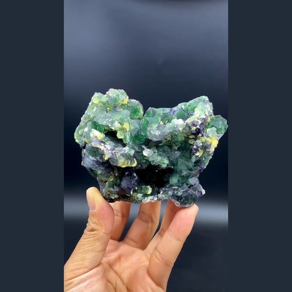 Green cubic fluorite with yellow mica and black tourmaline from South Africa — alternate view