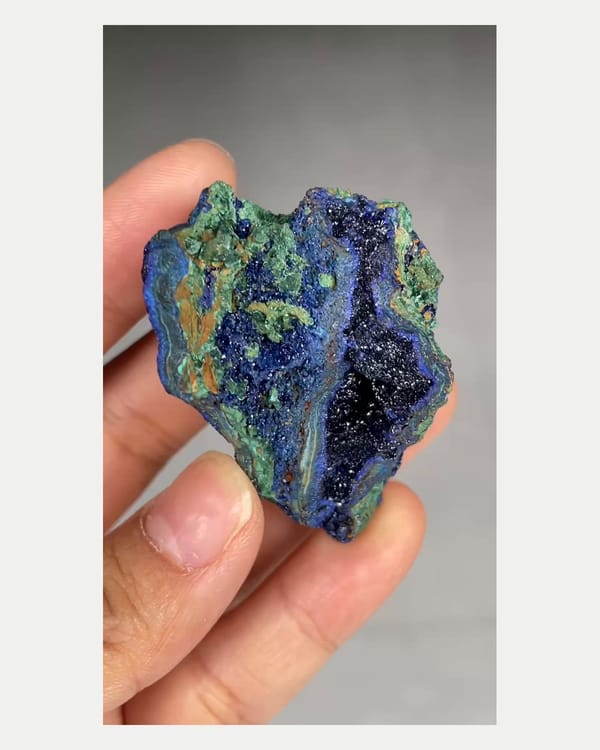 Complete left oblique view of azurite geode with malachite