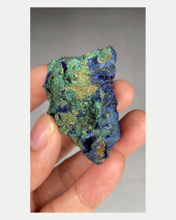 Complete reverse view of azurite geode with malachite
