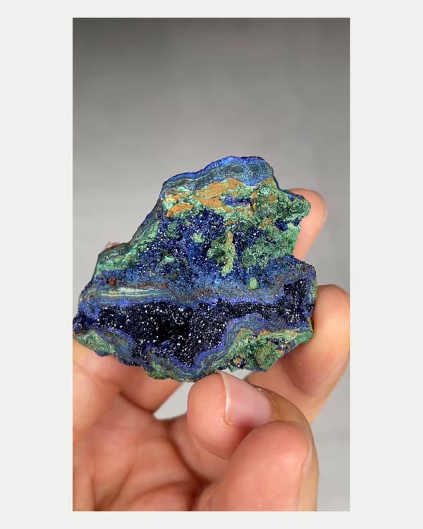 Complete right oblique view of azurite geode with malachite