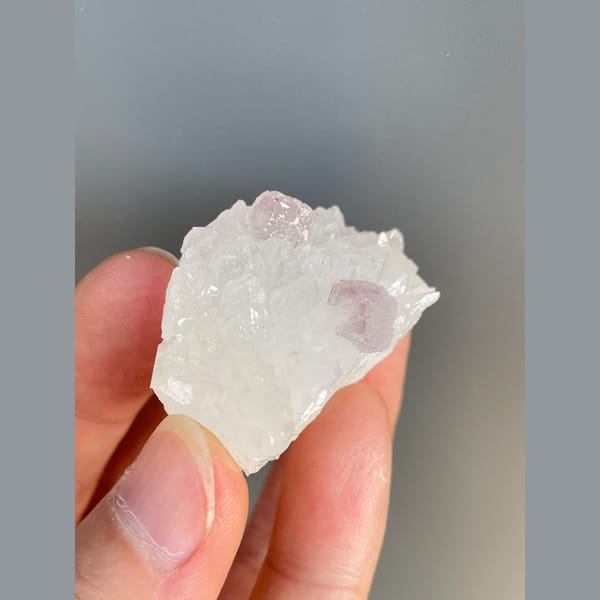 Pale pink fluorite crystals on white quartz from Zhejiang — alternate view