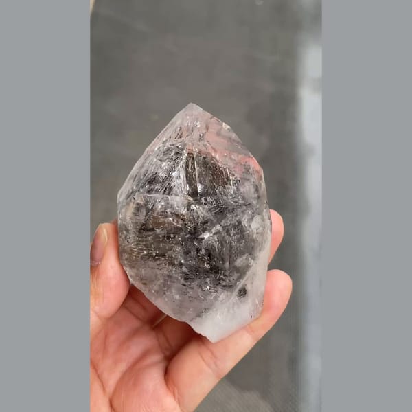 Large skeletal quartz with dark smoky inclusions from Jinkouhe — detail view