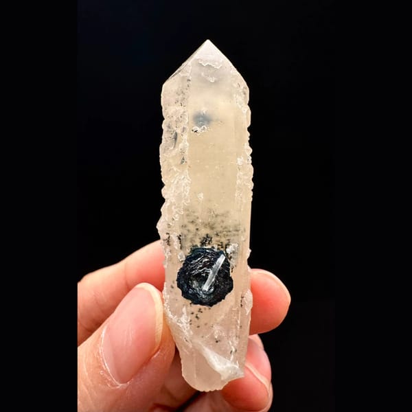 Pale quartz crystal with a specular hematite rosette from Inner Mongolia — complete view