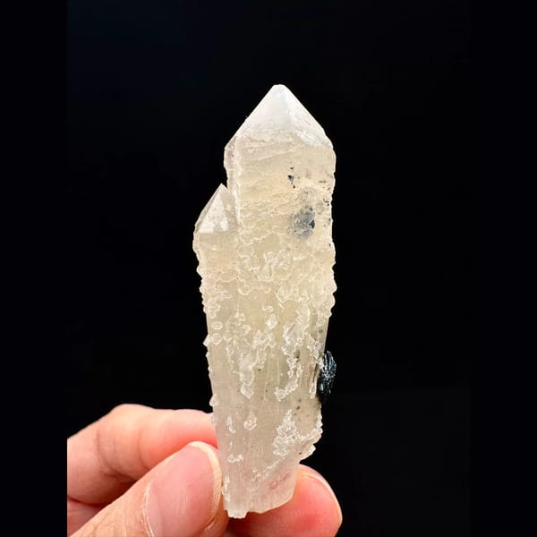 Pale quartz crystal with a specular hematite rosette from Inner Mongolia — alternate view