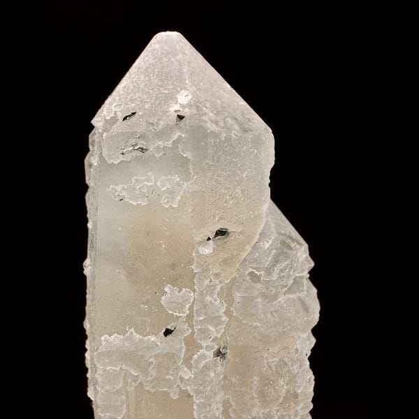 Pale quartz crystal with a specular hematite rosette from Inner Mongolia — detail view