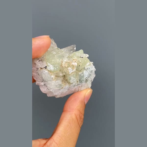 Pale green prehnite with clear quartz crystals from Zhaotong, Yunnan — alternate view