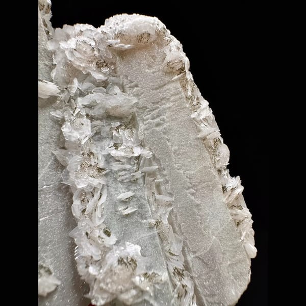 Twin sparkly quartz crystals with pale pink petal calcite from Inner Mongolia — alternate view
