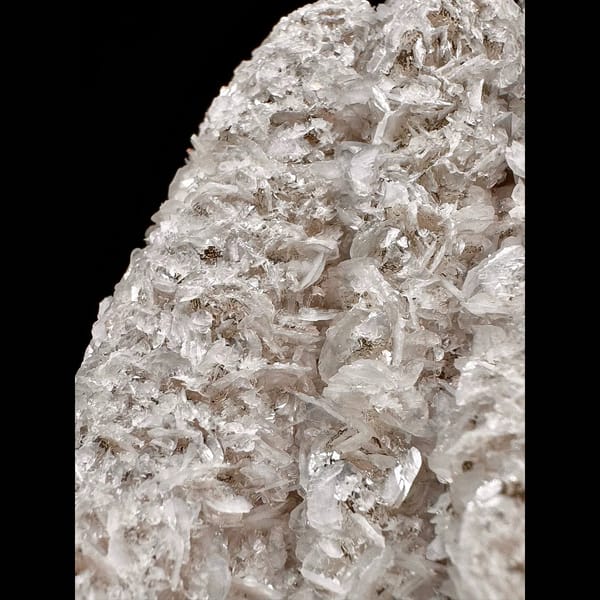 Twin sparkly quartz crystals with pale pink petal calcite from Inner Mongolia — detail view