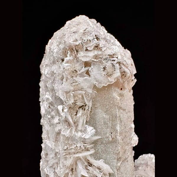 Twin sparkly quartz crystals with pale pink petal calcite from Inner Mongolia — detail view