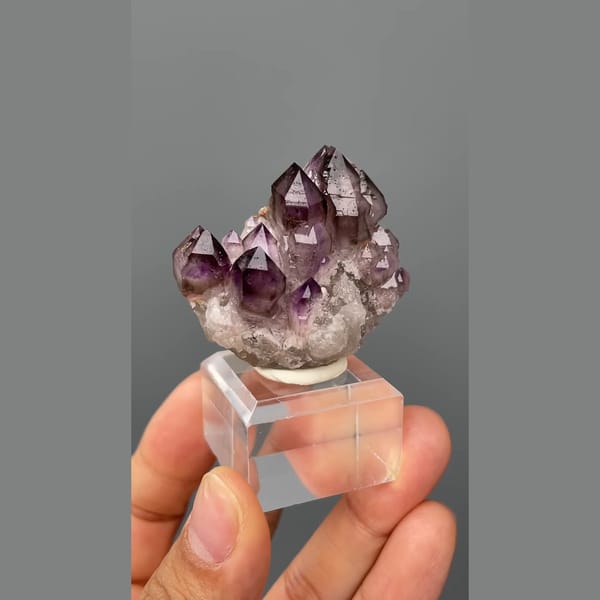 Castle-like cluster of deep purple amethyst points from Namibia — complete view
