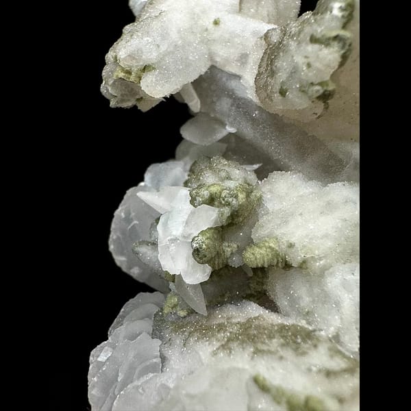 Sparkly quartz floater with white petal calcite from Inner Mongolia — detail view