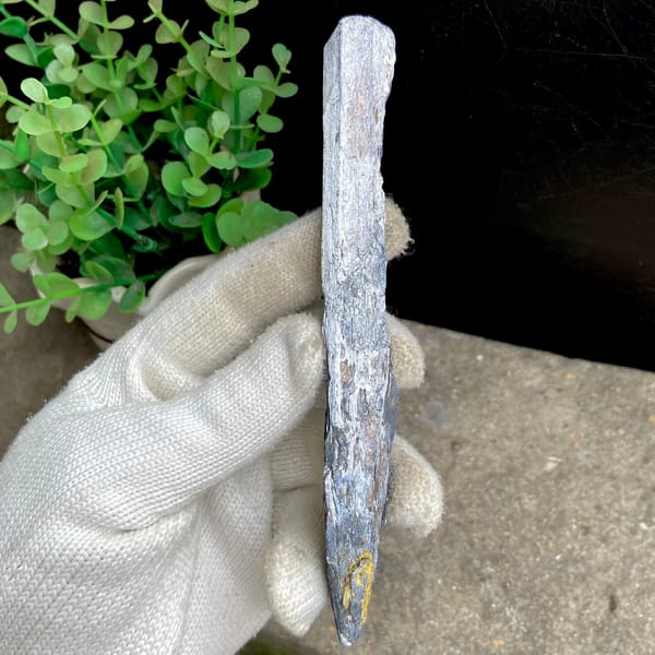 Long steel grey stibnite single crystal — detail view