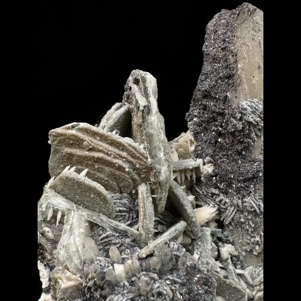 Quartz with green calcite, dogtooth calcite and specular hematite from Inner Mongolia — detail view