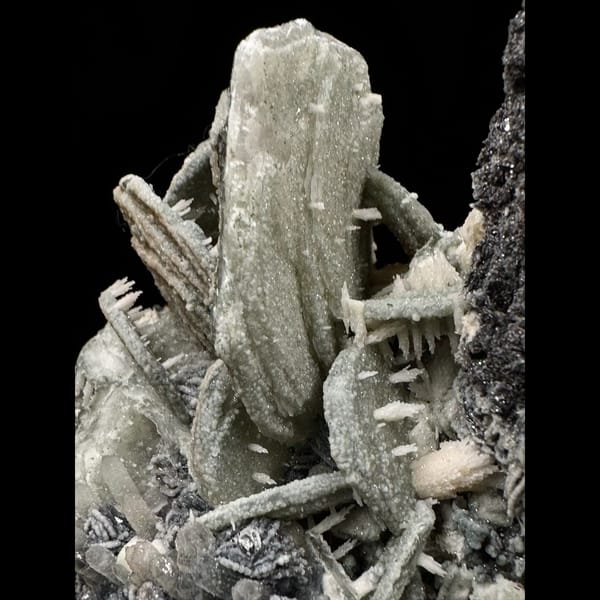 Quartz with green calcite, dogtooth calcite and specular hematite from Inner Mongolia — detail view