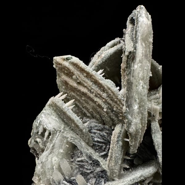 Quartz with green calcite, dogtooth calcite and specular hematite from Inner Mongolia — detail view