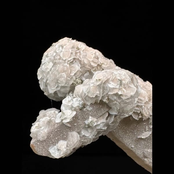 Extra-long sparkly quartz floater with petal calcite from Inner Mongolia — detail view