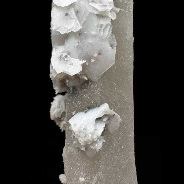 Sparkly quartz point with white petal calcite from Inner Mongolia — detail view