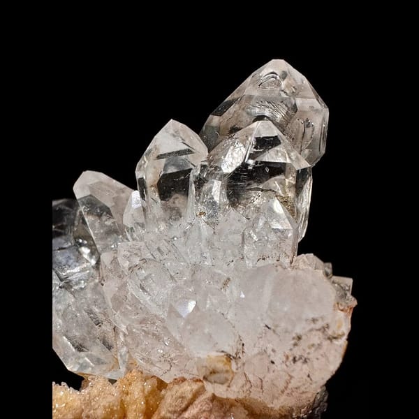 Clear skeletal quartz cluster on matrix from Namibia — detail view
