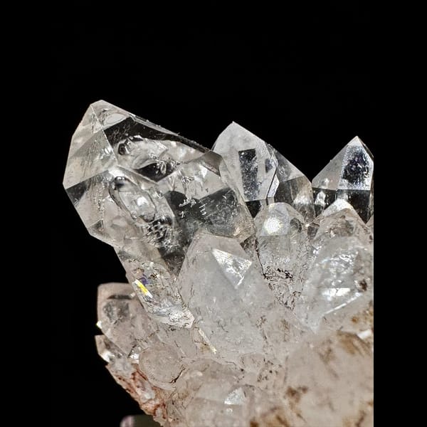 Clear skeletal quartz cluster on matrix from Namibia — detail view