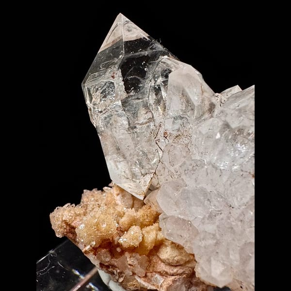 Clear skeletal quartz cluster on matrix from Namibia — detail view