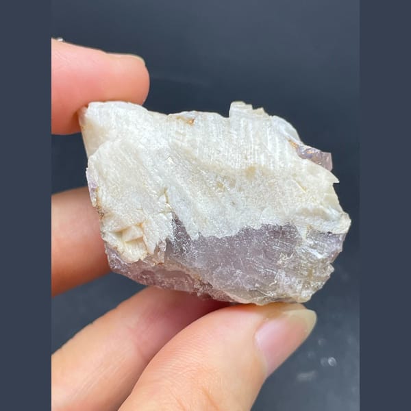 Purple fluorite cube with cream barite blades from Spain — detail view