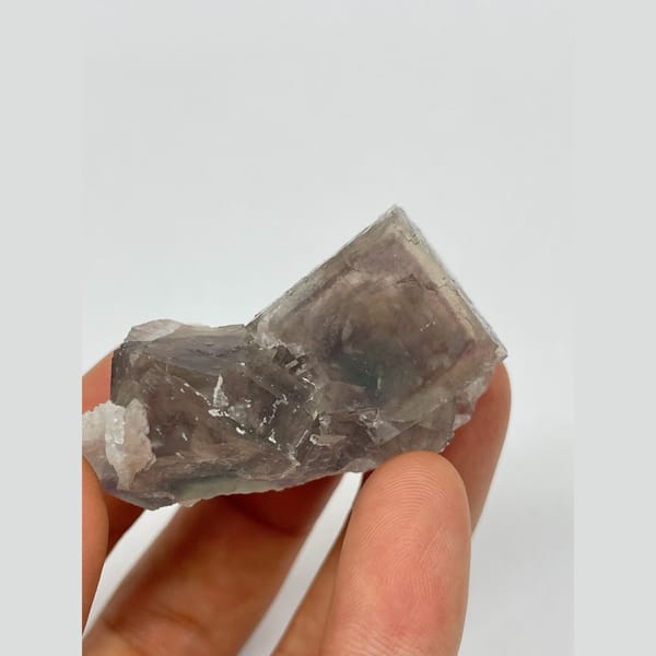 Translucent smoky grey-purple fluorite with two joined crystals from Zhejiang — alternate view