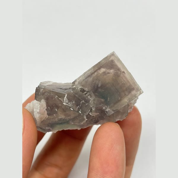 Translucent smoky grey-purple fluorite with two joined crystals from Zhejiang — alternate view