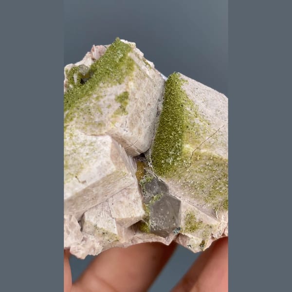 Fuzzy moss-green epidote on pale blocky crystals with chabazite from Yunxiao, Fujian — alternate view