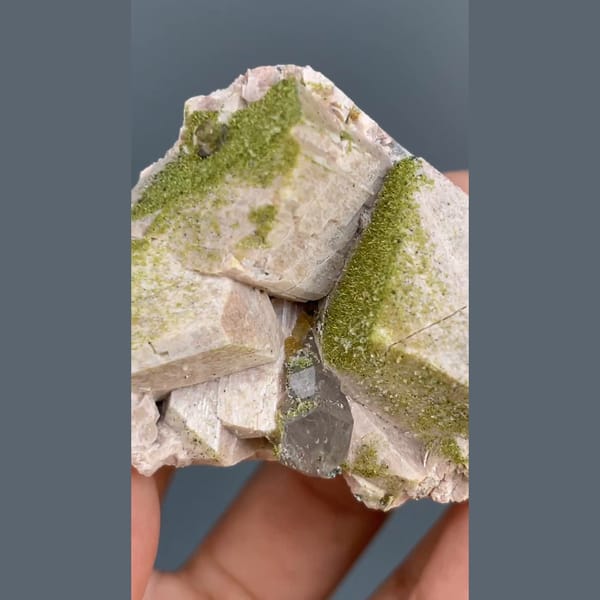 Fuzzy moss-green epidote on pale blocky crystals with chabazite from Yunxiao, Fujian — detail view
