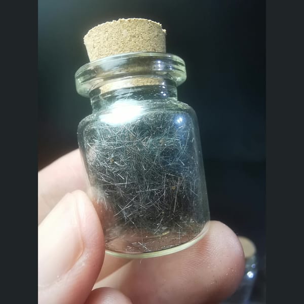 Hair-like Jamesonite Needles in a Glass Vial, natural mineral specimen, photo 1 of 3