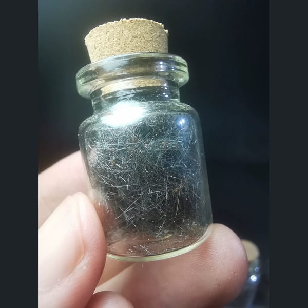 Hair-like Jamesonite Needles in a Glass Vial, natural mineral specimen, photo 3 of 3
