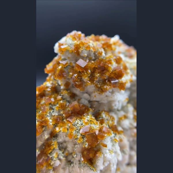 Orange chabazite over white feldspar from Yunxiao, Fujian — alternate view