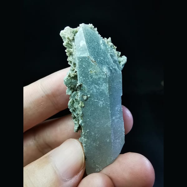 Quartz crystal with a burst of green calcite — alternate view