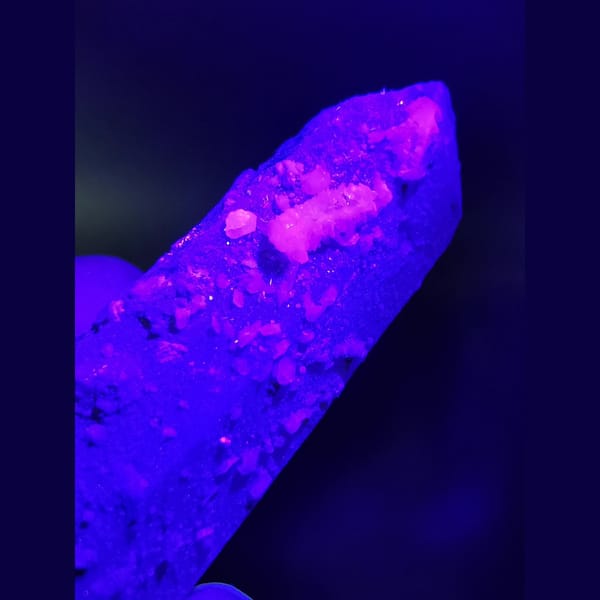 Quartz crystal with calcite and specular hematite — detail view