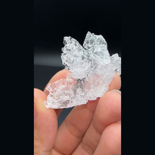 Water-clear deeply etched pollucite crystal from Skardu, Pakistan — detail view