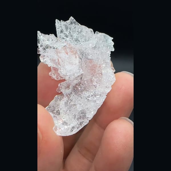 Water-clear deeply etched pollucite crystal from Skardu, Pakistan — detail view