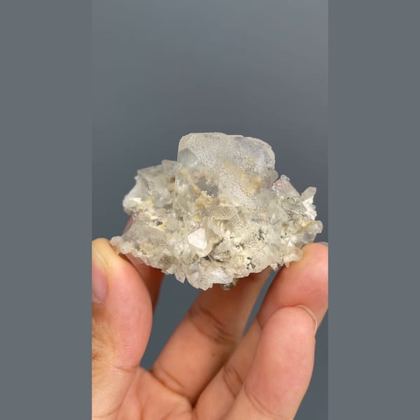 Colourless fluorite crystal on a sparkling matrix from Inner Mongolia — complete view