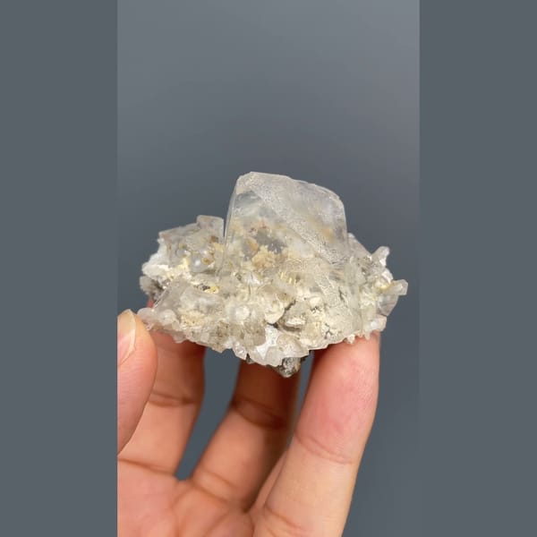 Colourless fluorite crystal on a sparkling matrix from Inner Mongolia — detail view
